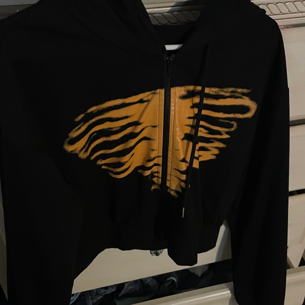 black and orange crop jacket